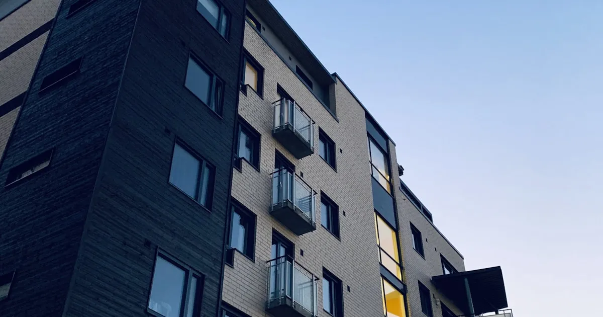 Interior of a modern glass elevator shaft in a high-rise building